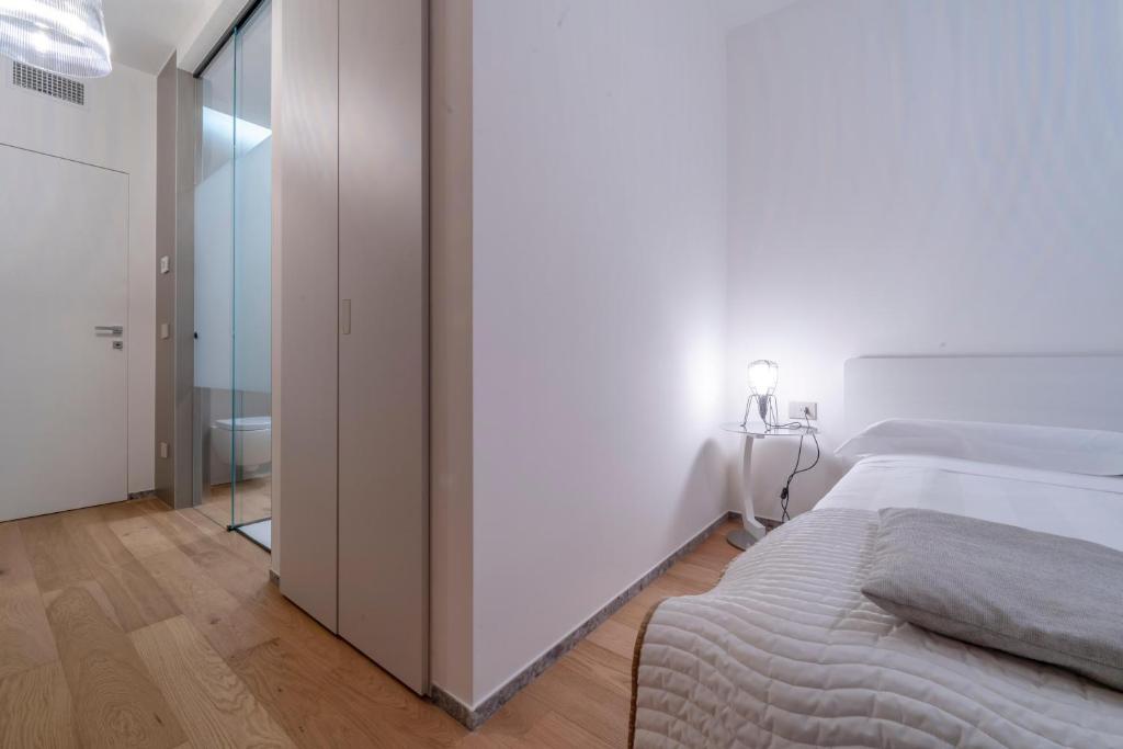Postel nebo postele na pokoji v ubytování Kalì Tribe Home