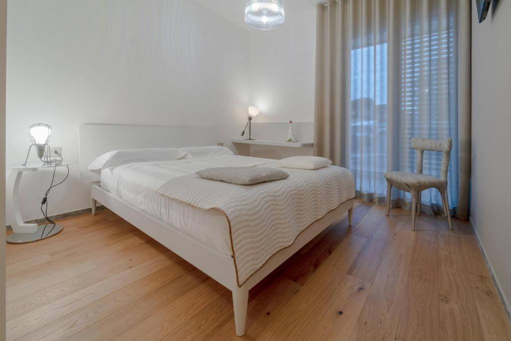 Postel nebo postele na pokoji v ubytování Kalì Tribe Home