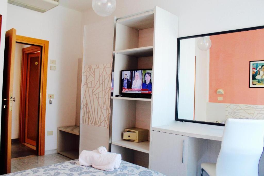 Postel nebo postele na pokoji v ubytování Hotel President