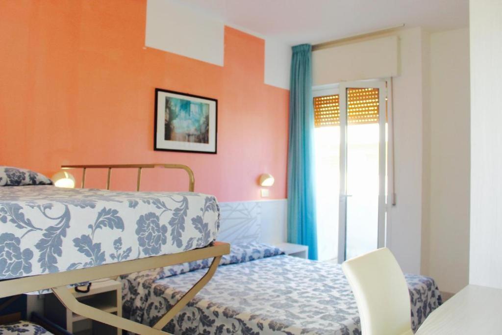 Postel nebo postele na pokoji v ubytování Hotel President