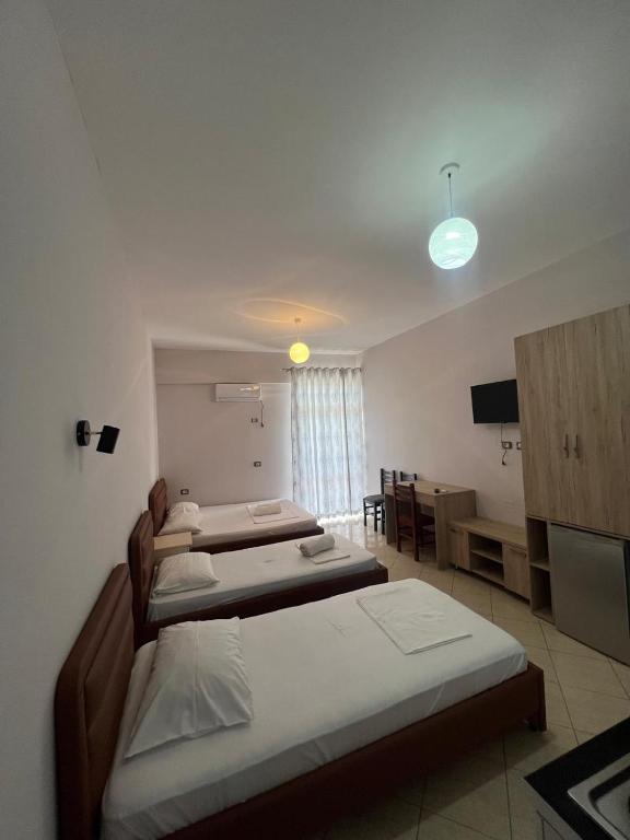 Postel nebo postele na pokoji v ubytování Hotel Vila Flowers