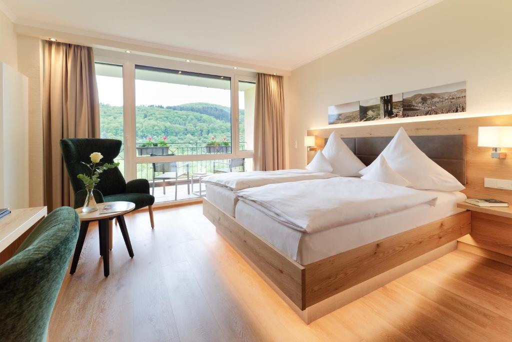 Postel nebo postele na pokoji v ubytování Hotel Weis