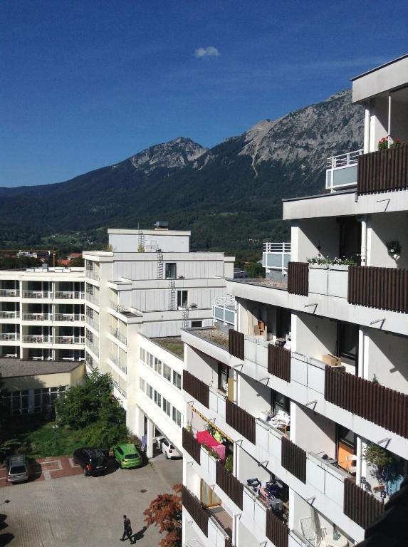 an apartment building with a mountain in the background at Panoramahaus Apartment 7152 in Bad Reichenhall