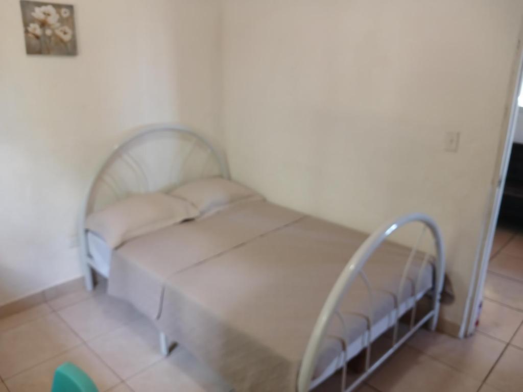 Postel nebo postele na pokoji v ubytování Hotel Cabañas Casita La Ermita