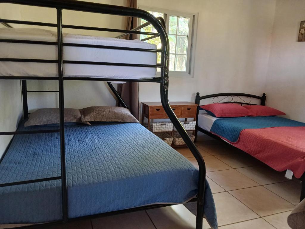 Postel nebo postele na pokoji v ubytování Hotel Cabañas Casita La Ermita