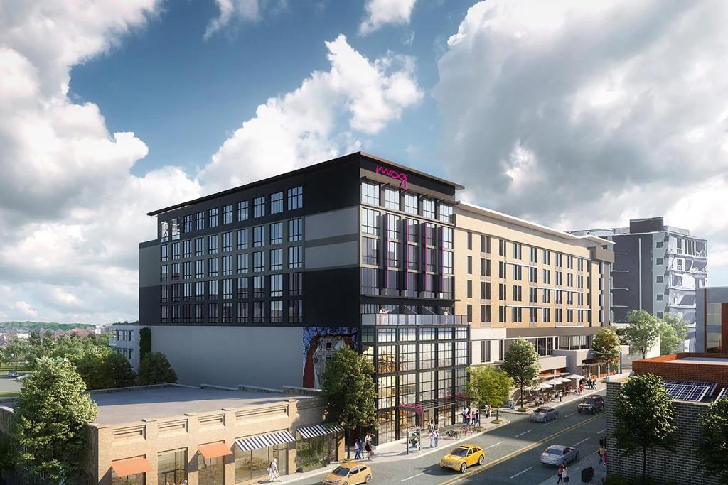 a rendering of a black building on a city street at Moxy Asheville in Asheville