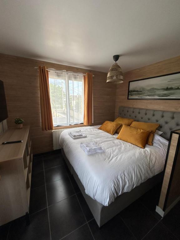 Ένα ή περισσότερα κρεβάτια σε δωμάτιο στο appartement ILLUSION