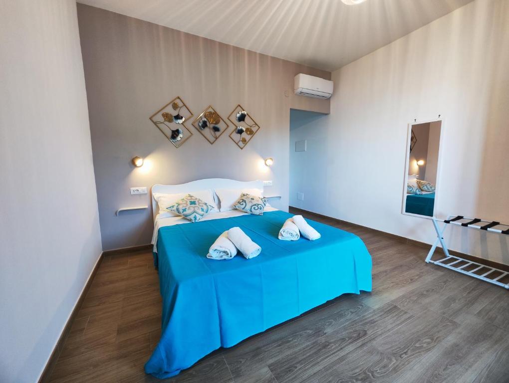 Postel nebo postele na pokoji v ubytování Malù B&B