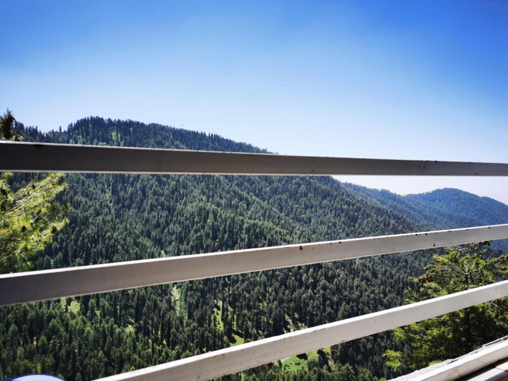 a view from a window of a mountain view at Drowned in Clouds V2 in Nathia Gali