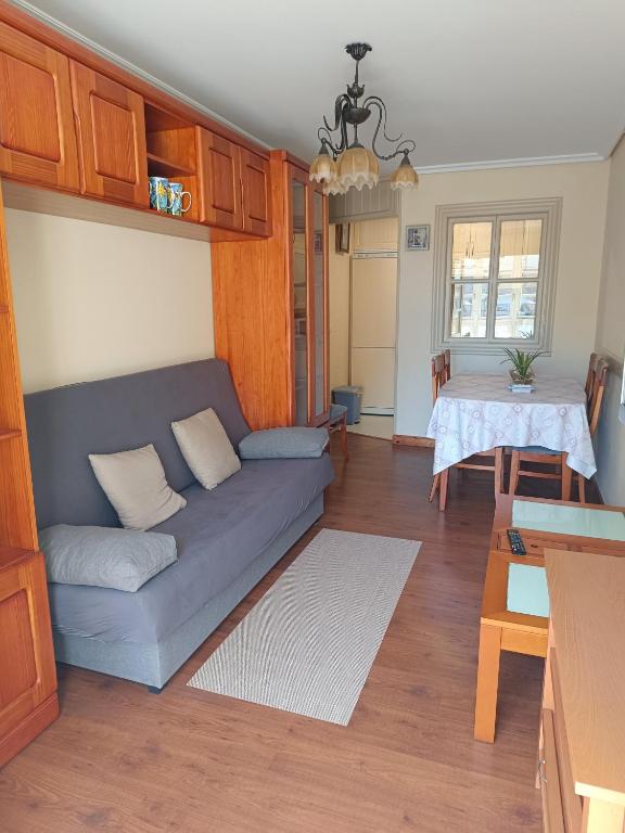 a living room with a couch and a table at El espolon in Comillas