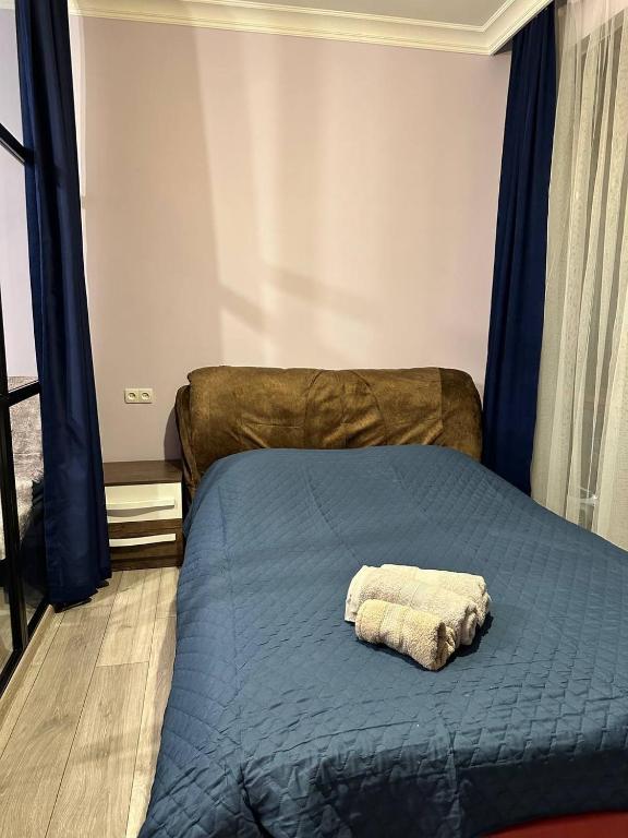 Postel nebo postele na pokoji v ubytování Apartment Merabi
