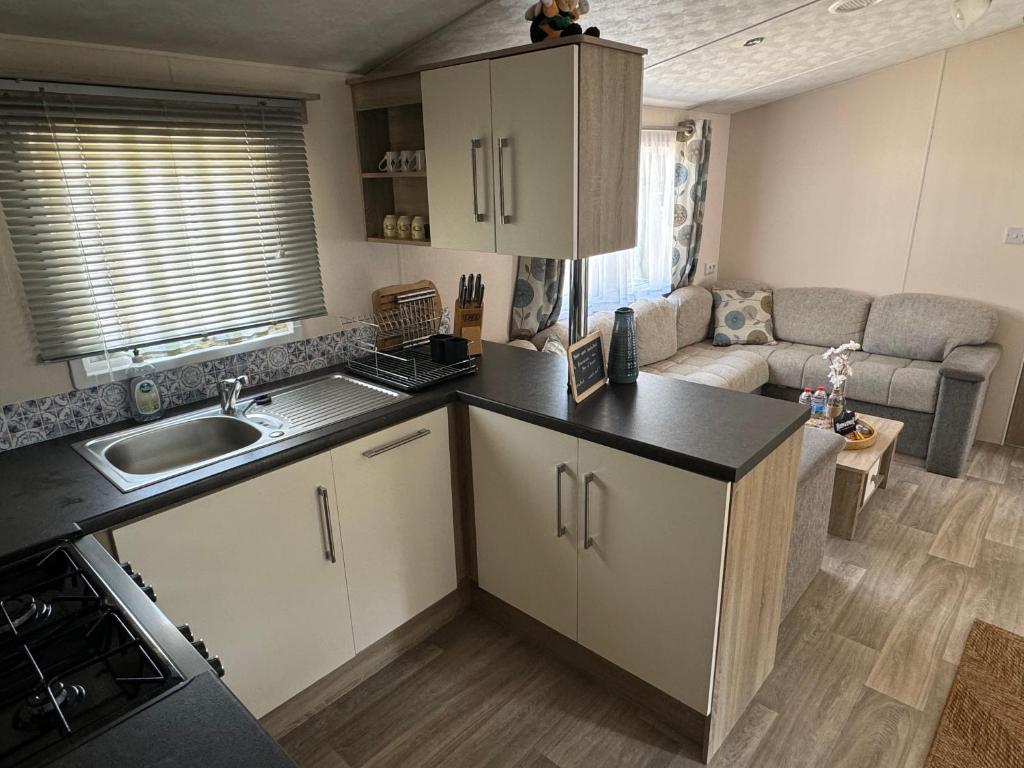 Kuchyň nebo kuchyňský kout v ubytování Mobil-home tout confort