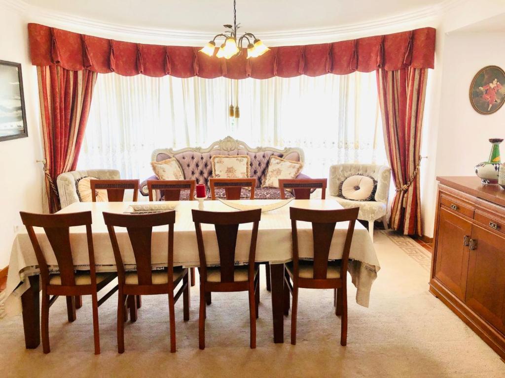 a dining room with a table and chairs at Grace Villa in Aldeia de Juso