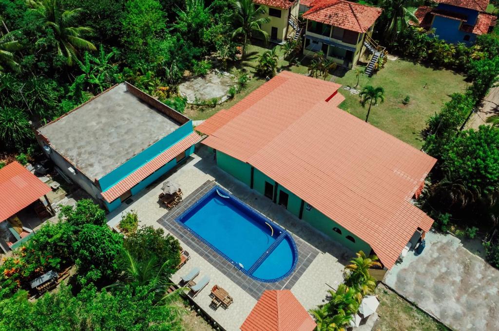 an overhead view of a house with a swimming pool at Ajubá Pousada in Morro de São Paulo