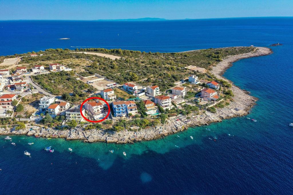 an island in the ocean with a red circle on it at Apartments by the sea Razanj, Rogoznica - 2970 in Rogoznica