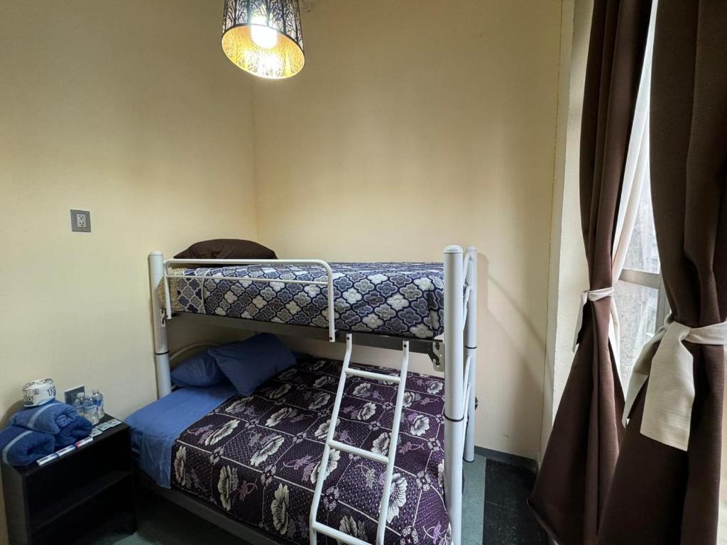 Postel nebo postele na pokoji v ubytování Rooms Zocalo