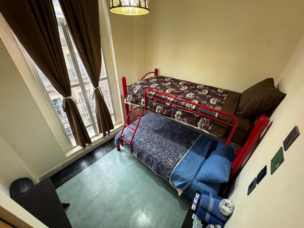 Postel nebo postele na pokoji v ubytování Rooms Zocalo