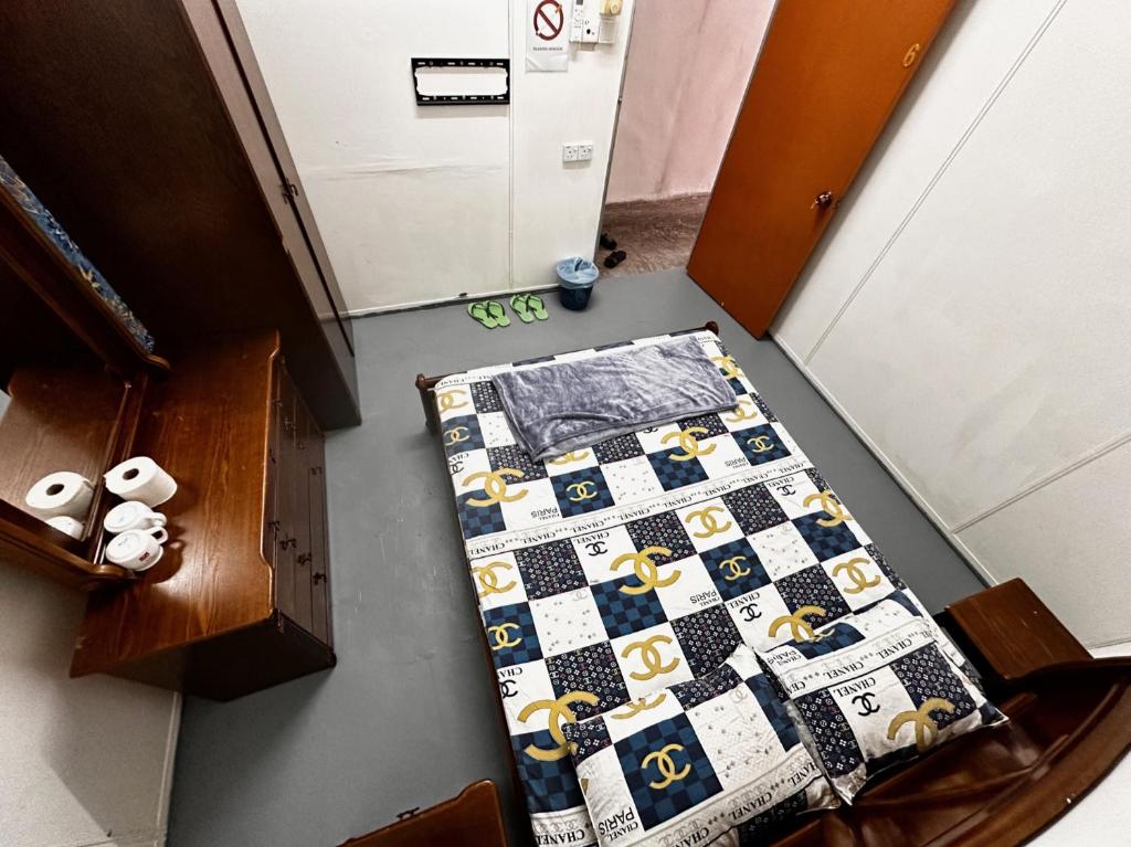 Voodi või voodid majutusasutuse Jiaxin Dormitory - Puteri Wangsa 家馨旅舍 toas