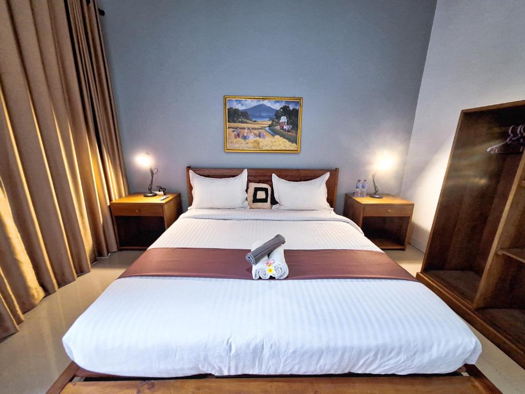 Postel nebo postele na pokoji v ubytování Novia Guest House Lombok-Tetebatu