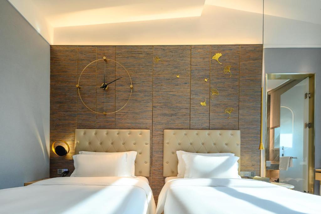Postel nebo postele na pokoji v ubytování Lux Cabins Hotel Shenzhen