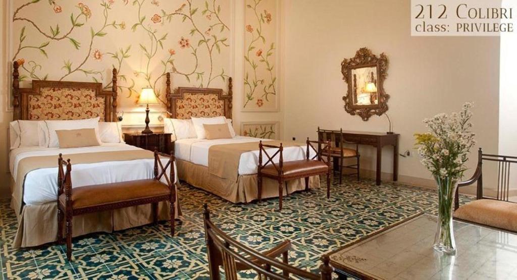 Postel nebo postele na pokoji v ubytování Mansión Mérida Boutique Hotel - Restaurant