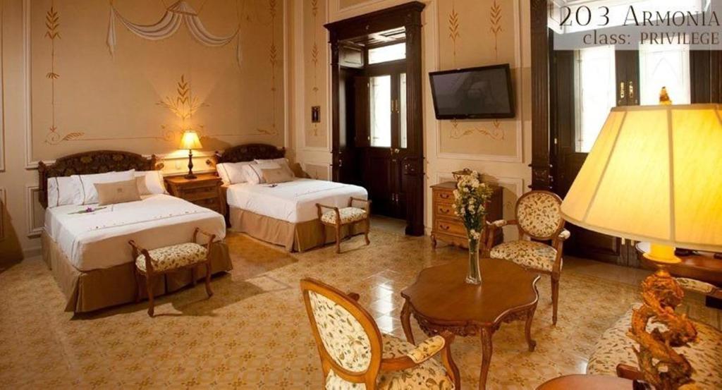 Postel nebo postele na pokoji v ubytování Mansión Mérida Boutique Hotel - Restaurant