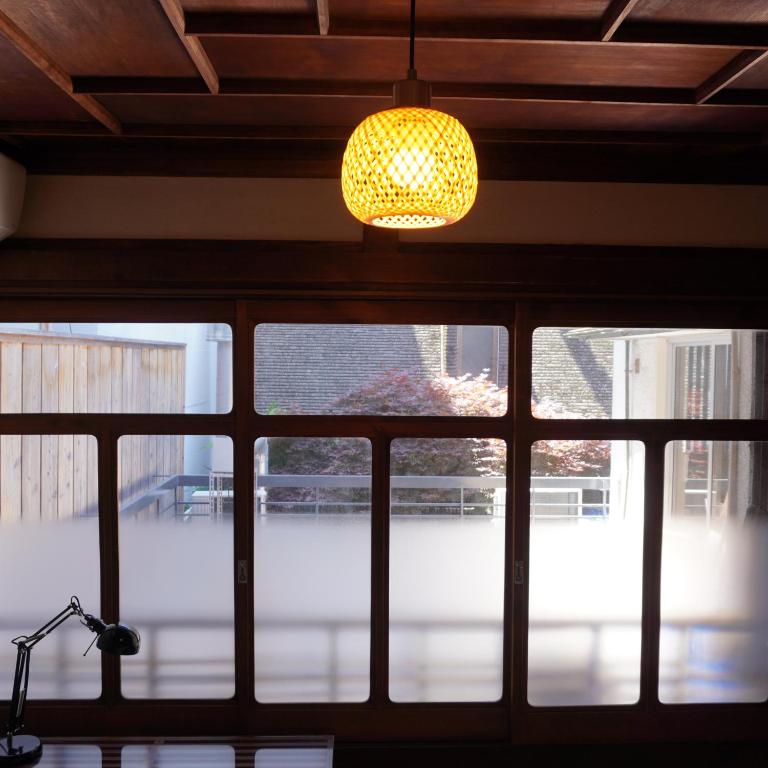 a chandelier hanging over a window in a building at Guest House BONITO in Kochi