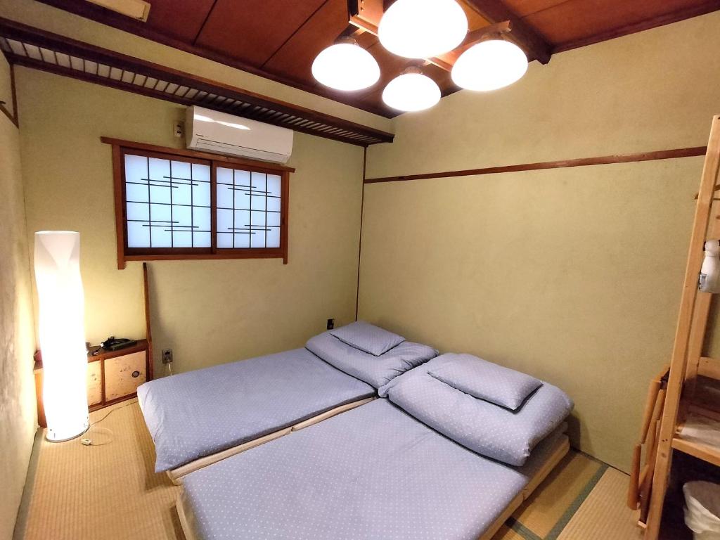 Postel nebo postele na pokoji v ubytování Hostel Caranashi