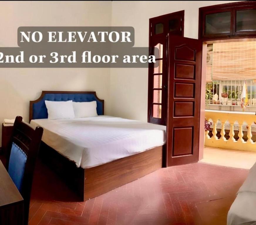 a bedroom with a bed with no elevator and or floor area at Hanoi Hidden Guest House in Hanoi