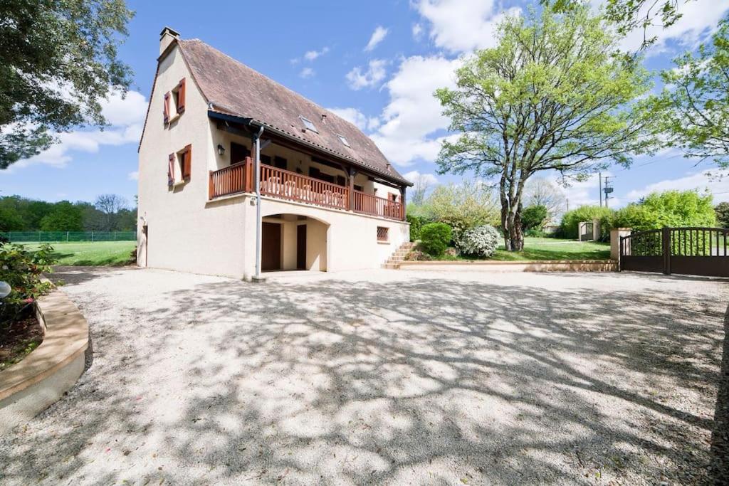 a large white building with a balcony on it at Villa Perigord in Gourdon-en-quercy