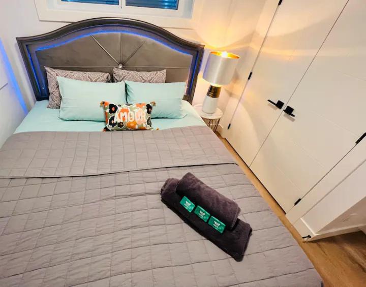 a bedroom with a large bed in a room at B21 River Valley 2bd Basement Suite in Edmonton