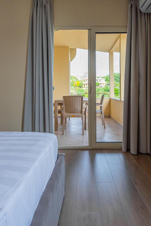 Postel nebo postele na pokoji v ubytování ApartHotel EDA