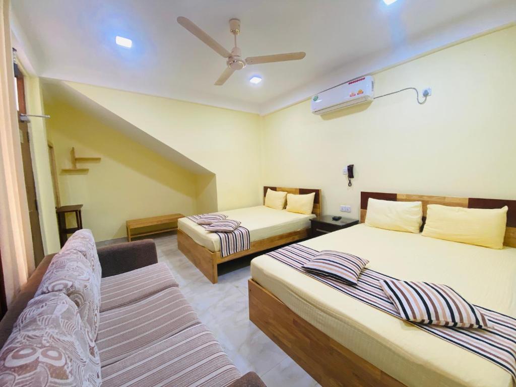 Postel nebo postele na pokoji v ubytování Sparkling Resort Kataragama