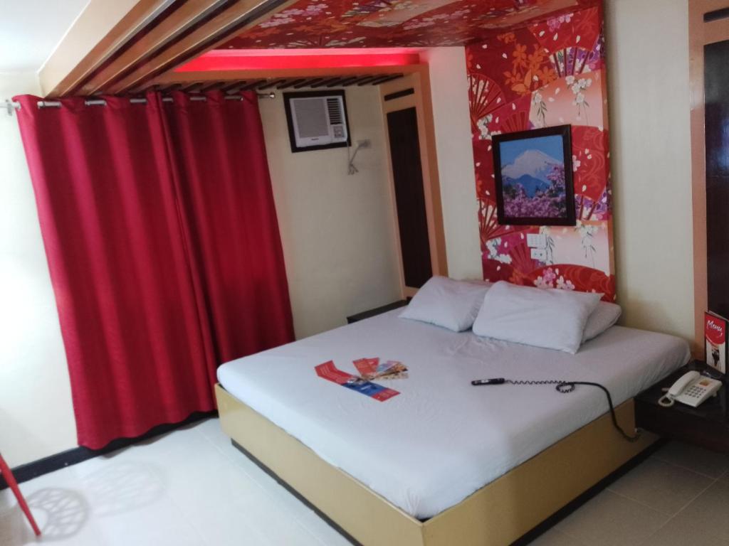 Postel nebo postele na pokoji v ubytování Hotel Sogo - EDSA, Pasay Harrison