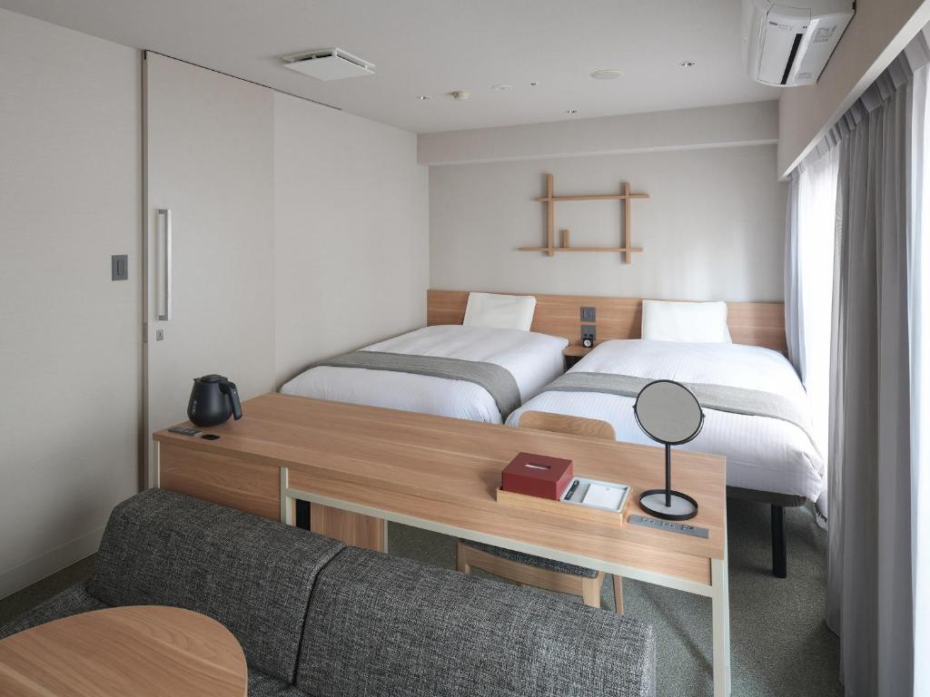 东京浅草筑波快速船舶酒店(Vessel Inn Asakusa Tsukuba Express)房間的床