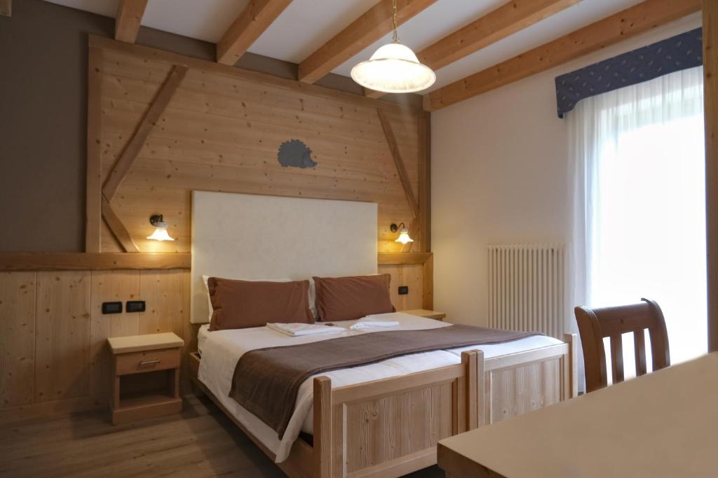 Postel nebo postele na pokoji v ubytování Flos Hotel