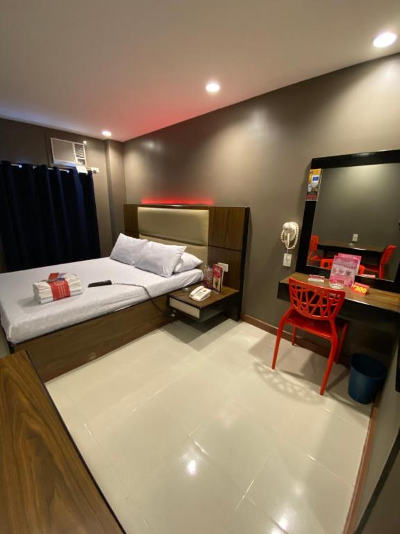 Postel nebo postele na pokoji v ubytování Hotel Sogo - EDSA Trinoma