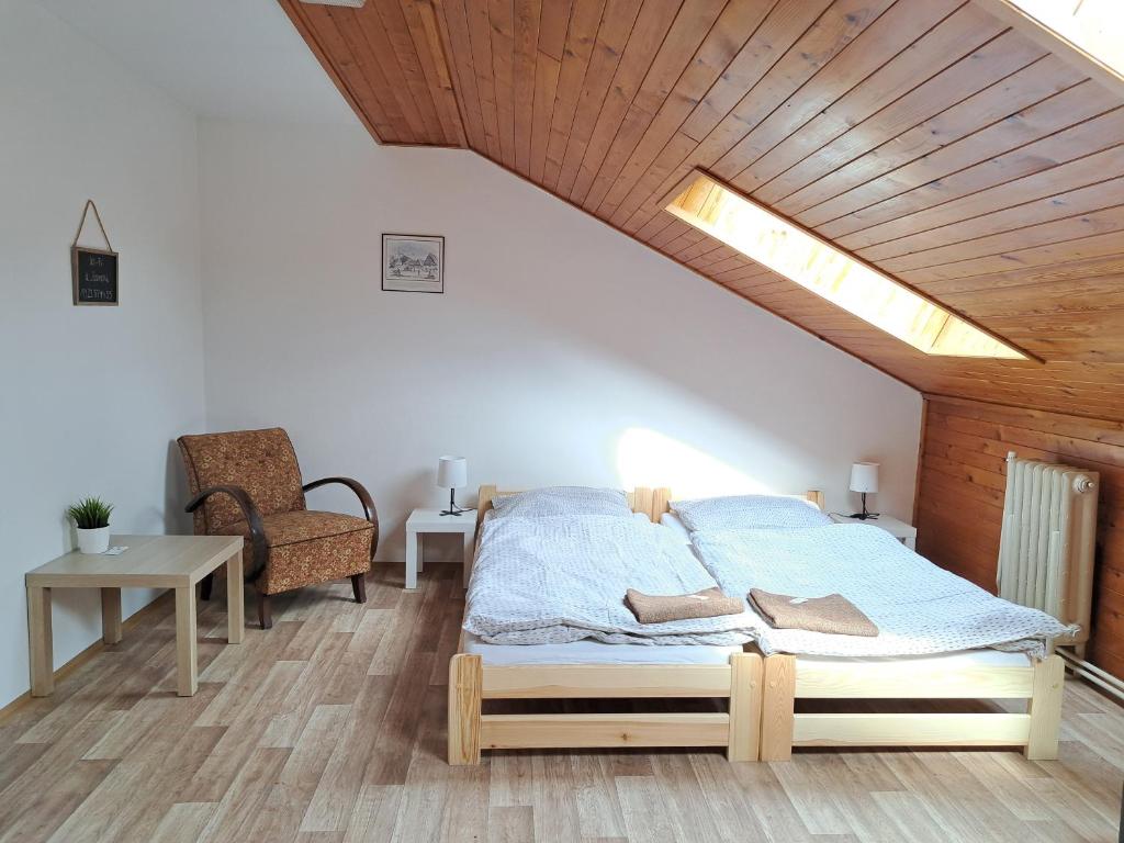 Postel nebo postele na pokoji v ubytování Penzion U Barešů