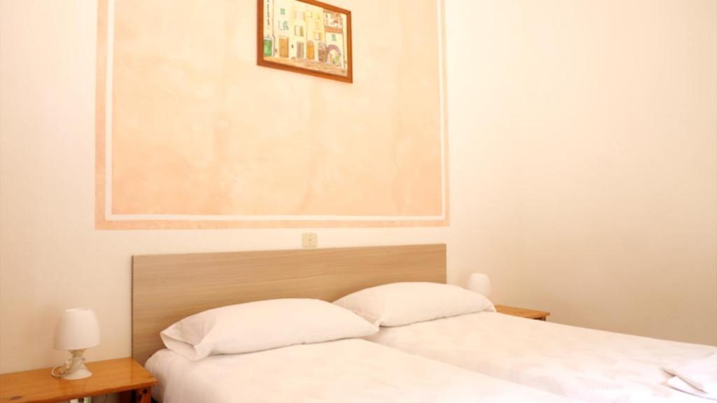 Postel nebo postele na pokoji v ubytování Villa Emma
