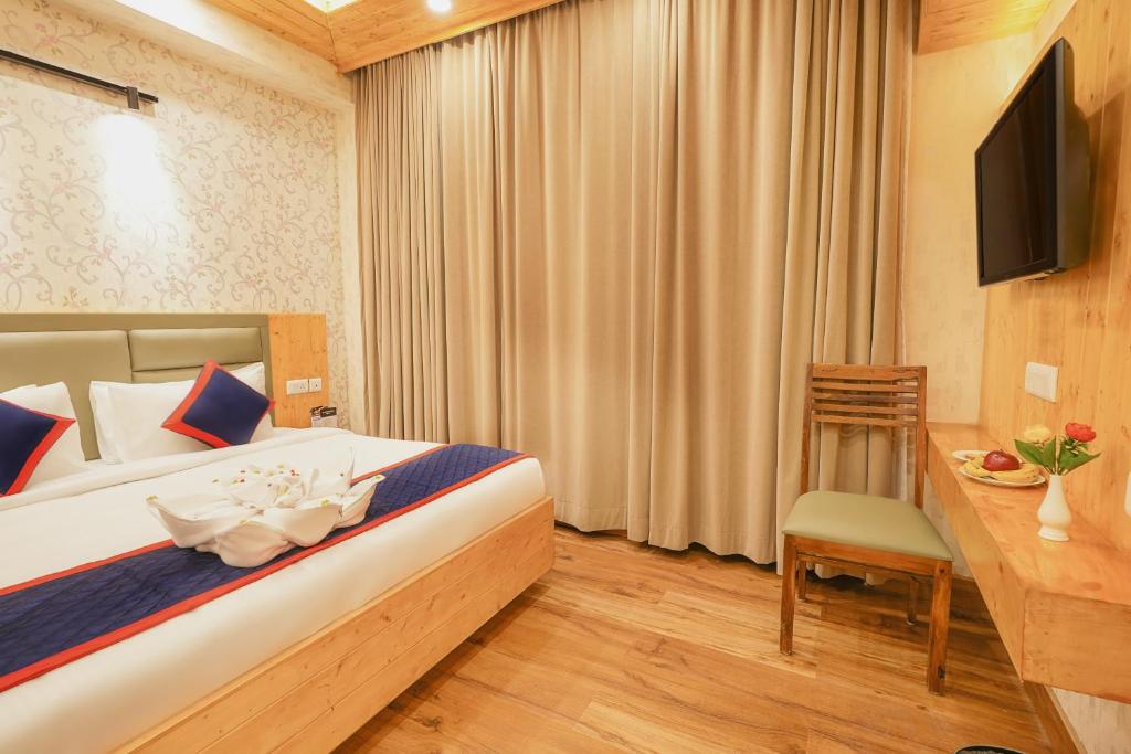 Postel nebo postele na pokoji v ubytování Zip By Spree Hotels Bella Heights Mcleodganj