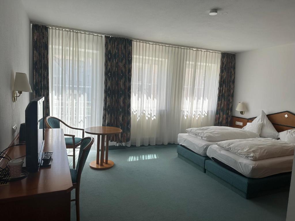 Postel nebo postele na pokoji v ubytování ST Hotel