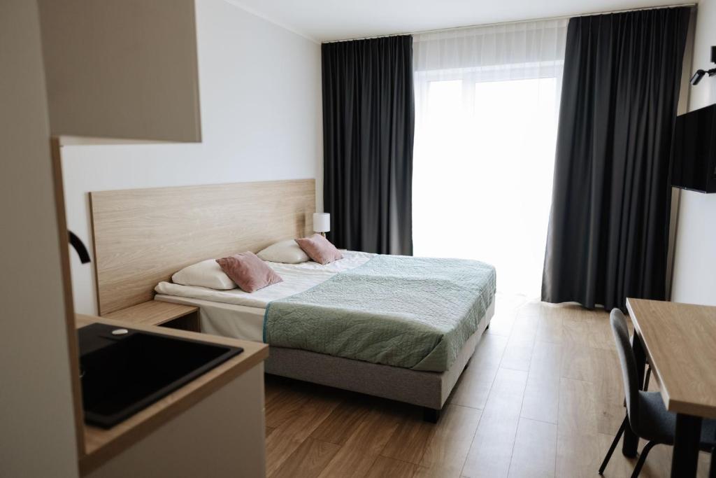 Postel nebo postele na pokoji v ubytování Zakrzówek Residence