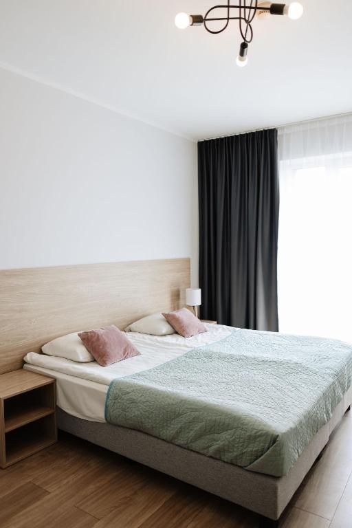 Postel nebo postele na pokoji v ubytování Zakrzówek Residence