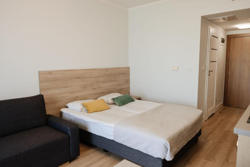 Postel nebo postele na pokoji v ubytování Zakrzówek Residence