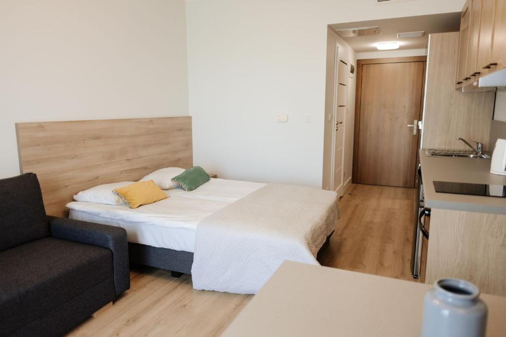 Postel nebo postele na pokoji v ubytování Zakrzówek Residence
