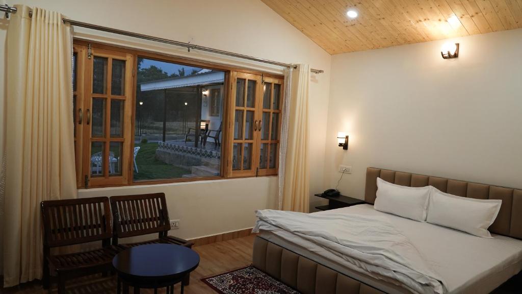 Postel nebo postele na pokoji v ubytování Saanjh Cottages