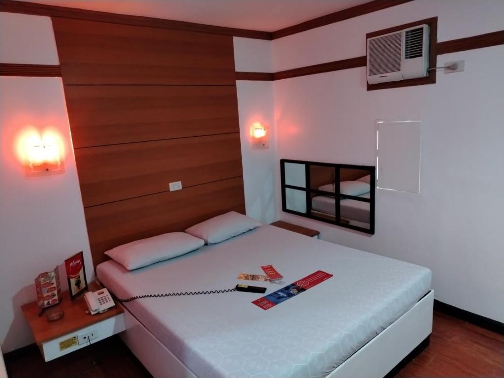 Giường trong phòng chung tại Hotel Sogo Cagayan De Oro
