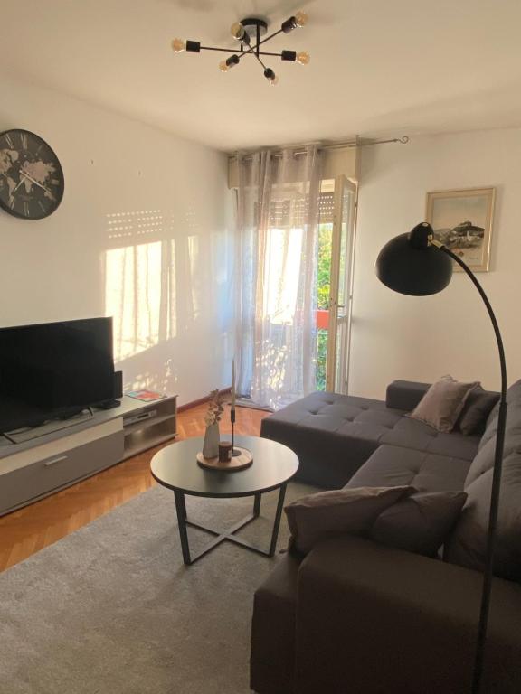 a living room with a couch and a table at Apartment Niko in Split