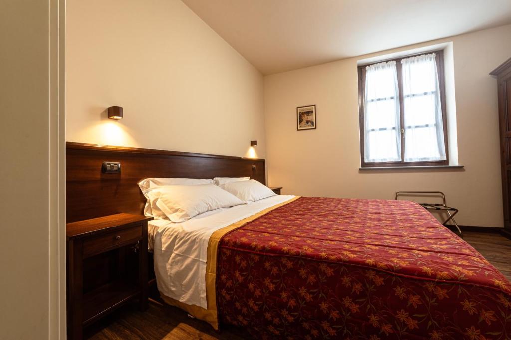 Postel nebo postele na pokoji v ubytování Dimora San Secondo