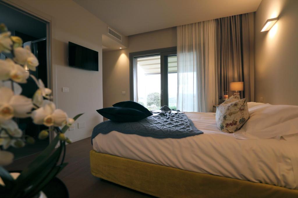 Postel nebo postele na pokoji v ubytování Agriturismo Le Piccole Macìe